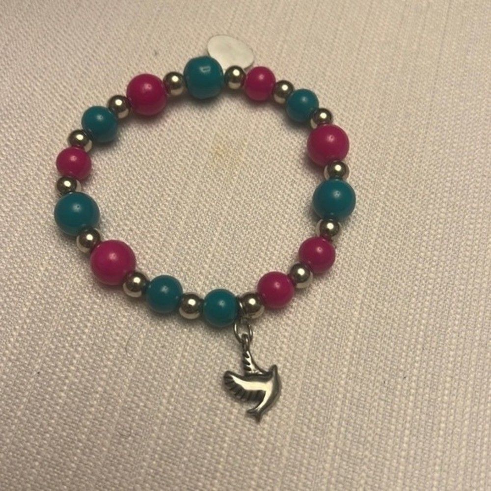 Handcrafted pink and turquoise glass bead bracelet with dove charm